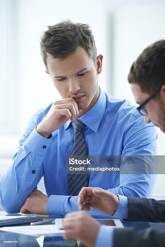 Business study Handsome manager listening to experienced businessman 20-29 Years Stock Photo