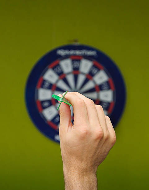 istock human hand with dart closeup 509959101
