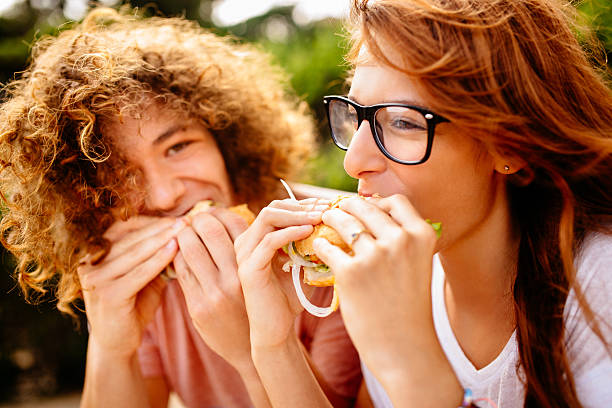 istock Couple Eating Burgers 509959505