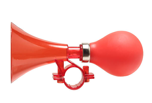 Red color bicycle air horn isolated on white.