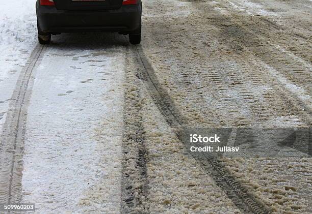 Car Tracks In The Snow Stock Photo - Download Image Now - Alley, Avenue, Bumpy