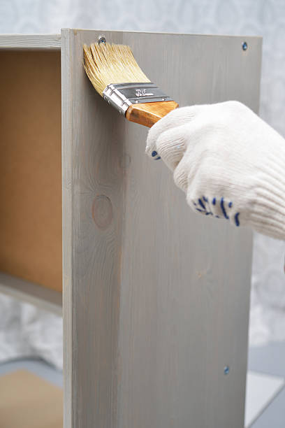 istock Varnishing the wooden chest 509962063