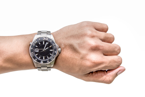 Watch on wrist isolated over a white background