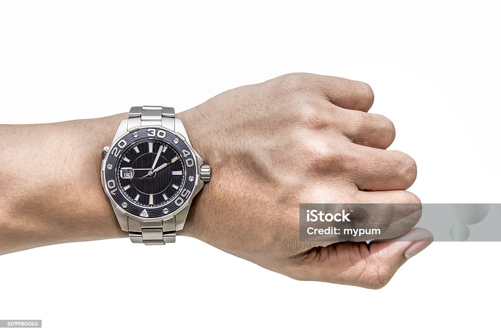 Watch on wrist isolated over a white background A man hand with Watch on wrist isolated over a white background Watch - Timepiece Stock Photo