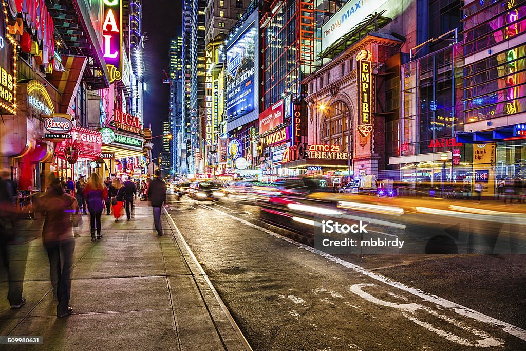 42nd street at night, New York City, USA Night life on busy 42nd street near 8th avenue in Middtown Manhattan, New York City. New York City Stock Photo