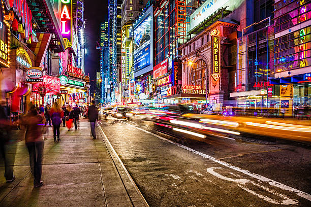 42nd street at night, New York City, USA Night life on busy 42nd street near 8th avenue in Middtown Manhattan, New York City. midtown manhattan photos stock pictures, royalty-free photos & images