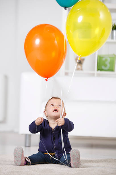 istock Little girl with balloons 509983785