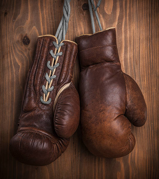 istock Boxing gloves hanging on wooden wall 509986213