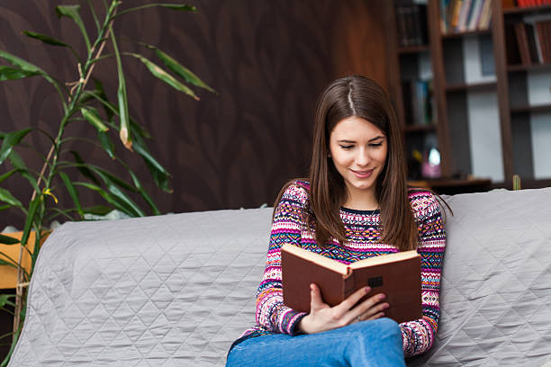 istock Woman reading a book 509991646