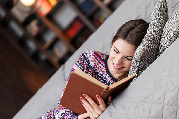 istock Woman reading a book 509992070
