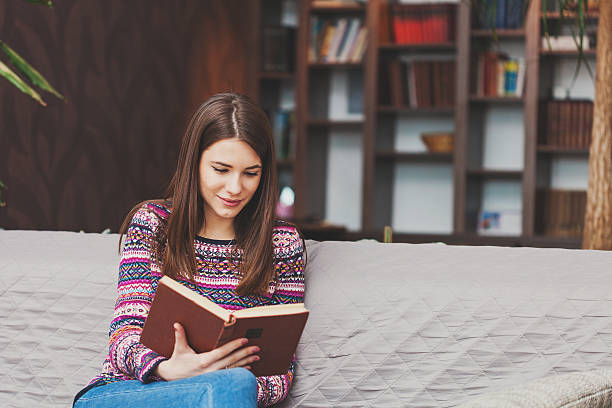 istock Woman reading a book 509992238