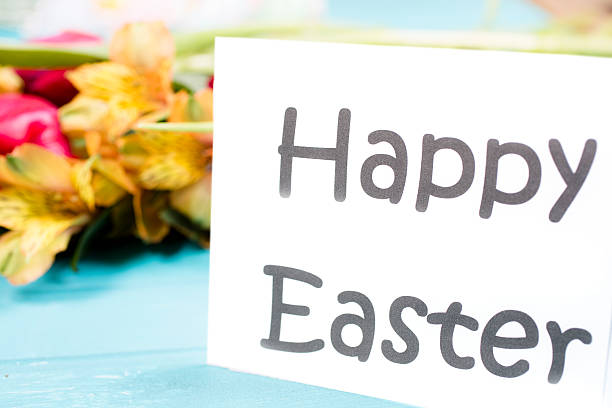 istock Happy Easter sign on vintage table. Spring flowers. 509992286