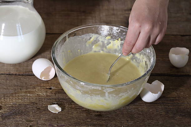 istock The woman gets mixed up batter 509994578