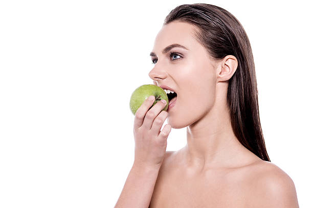 istock Woman eating apple 509995720