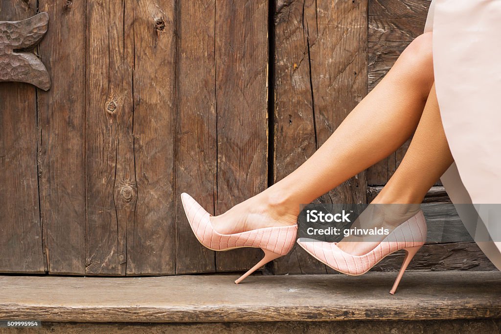 Nude high heel shoes Close-up image of fashion model's legs in nude high heel shoes High Heels Stock Photo