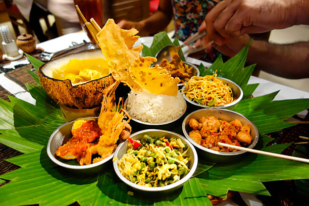 A table laid with a feast of Indonesian food dishes