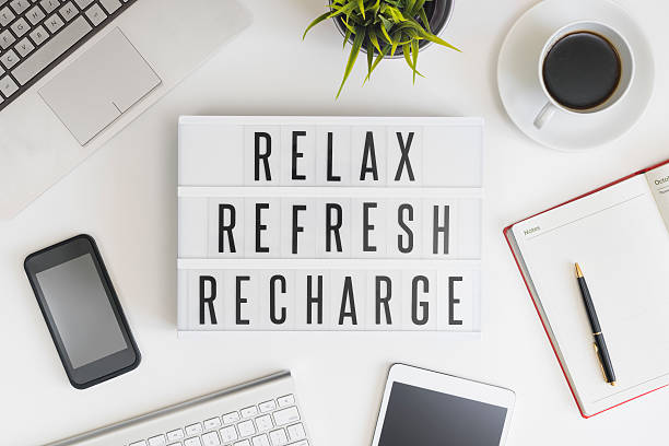 Relax, refresh and recharge in office Relax, refresh and recharge words on office table with computer, coffee, notepad, smartphone and digital tablet sunday stock pictures, royalty-free photos & images