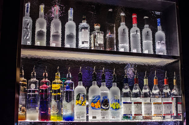 istock Back of a bar shelf through rippled glass 509998332