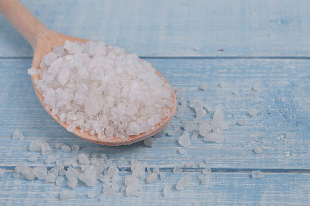 istock Sea salt in spoon on a wooden table 509999844