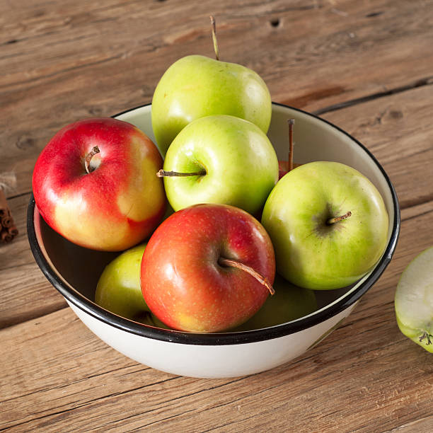 istock Red and green juicy apples placed in a bowl 510000104