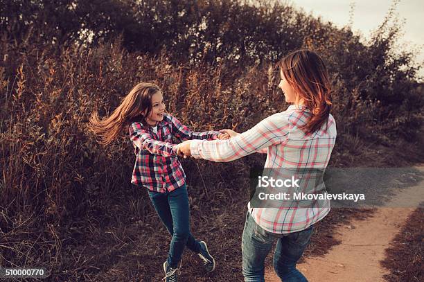 Happy Mother And Daughter On The Walk On Summer Field Stock Photo - Download Image Now