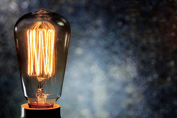 istock Macro vintage light bulb filament, bokeh light background 510002764