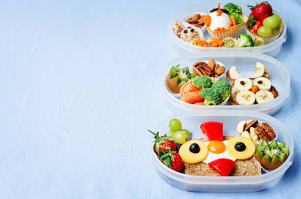 school lunch box for kids with food school lunch box for kids with food in the form of funny faces. the toning. selective focus bunny pancake stock pictures, royalty-free photos & images