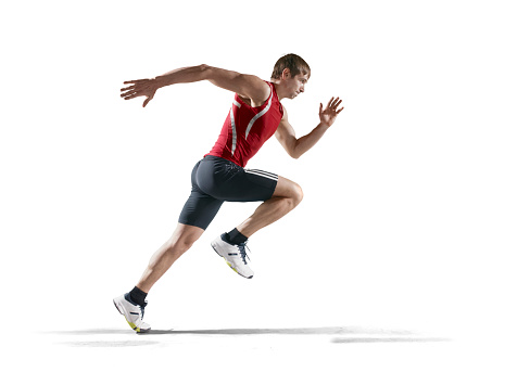 Isolated on white male athlete. The man is wearing an unbranded sports uniform and track shoes.