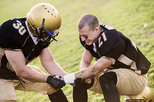 American Football Players Huddling During Time Out