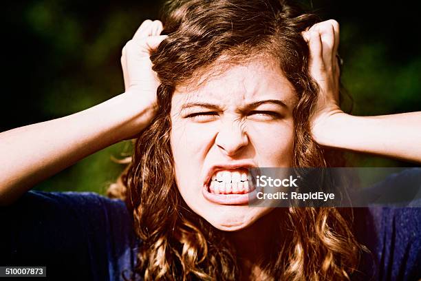 Furious Teenage Beauty Tears Her Hair Out In Frustration Tantrum Stock Photo - Download Image Now