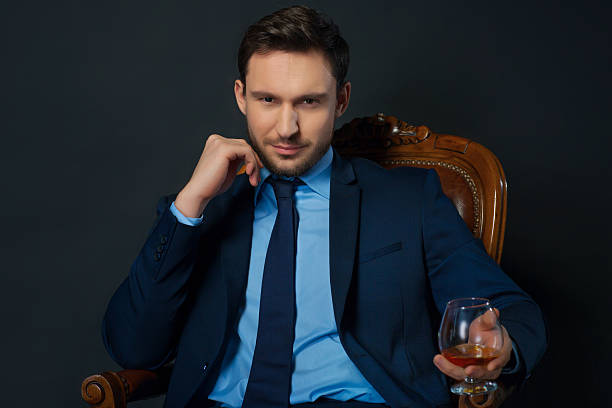 istock Handsome businessman drinking alcohol 510007960