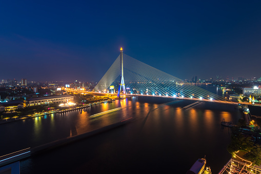 Rama VIII Bridge at night in Bangkok and Chopraya river in Bangkok