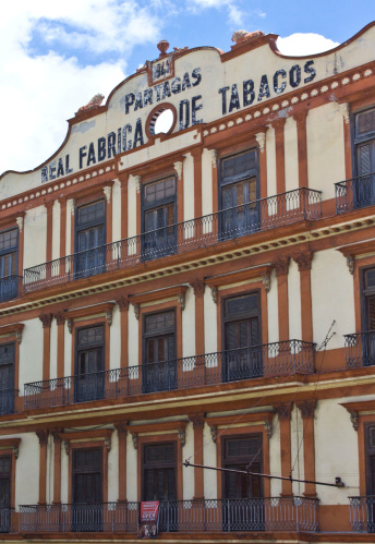 Havana, Cuba, August 9, 2012: The Real Fabrica de Tabacos Partagás, external facade. The world famous Habanos cigars are produced in this factory.