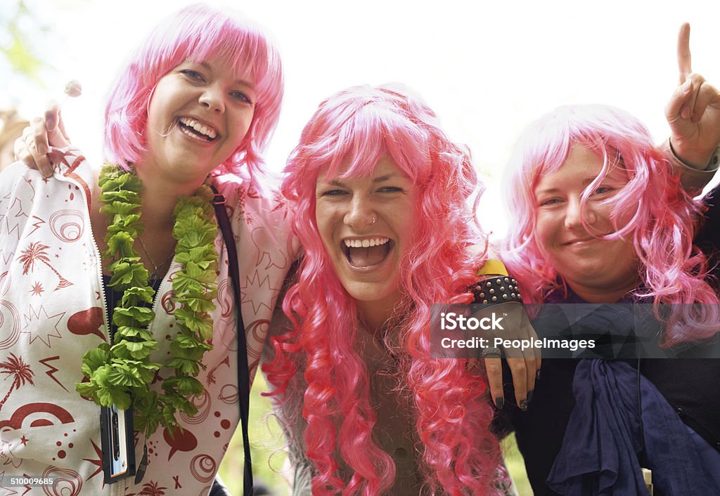 The pink brigade has arrived Three friends having fun at a festival 20-29 Years Stock Photo