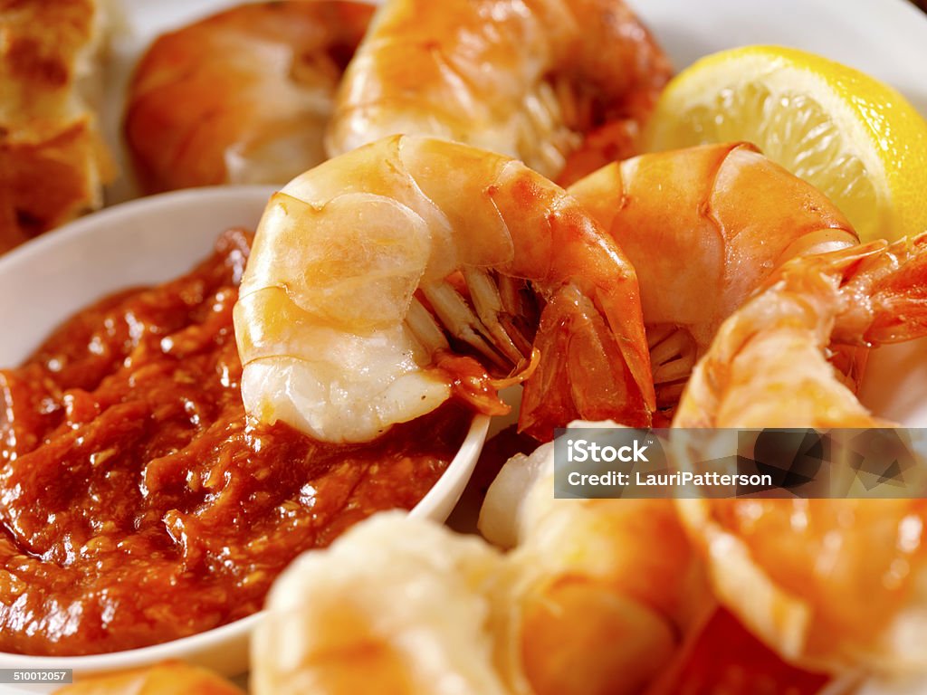 Peel and Eat Shrimp Peel and Eat Shrimp with Fresh Lemon and Seafood Sauce -Photographed on Hasselblad H3D2-39mb Camera Cocktail Stock Photo