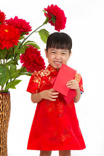 istock Chinese little girl holding red envelope 510013052