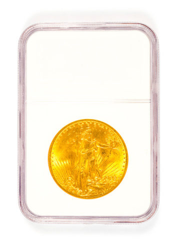Antique gold coin in a collector's case after being graded.