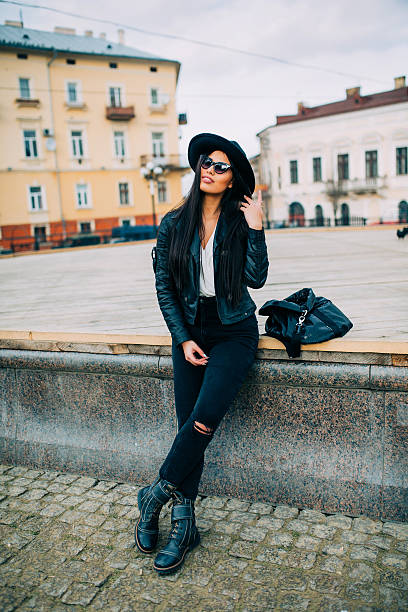 istock Brunette  sitting on a bench in the city streets. 510014602