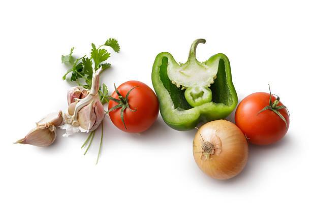 A selection of vegetables on a yellow surface