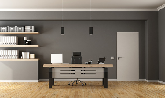 Contemporary office  with minimalist desk,closed door and shelves with binder - 3d Rendering
