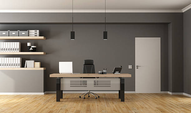 Contemporary office room Contemporary office  with minimalist desk,closed door and shelves with binder - 3d Rendering small office stock pictures, royalty-free photos & images
