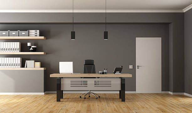 Contemporary office room Contemporary office with minimalist desk,closed door and shelves with binder - 3d Rendering small office interior stock pictures, royalty-free photos & images