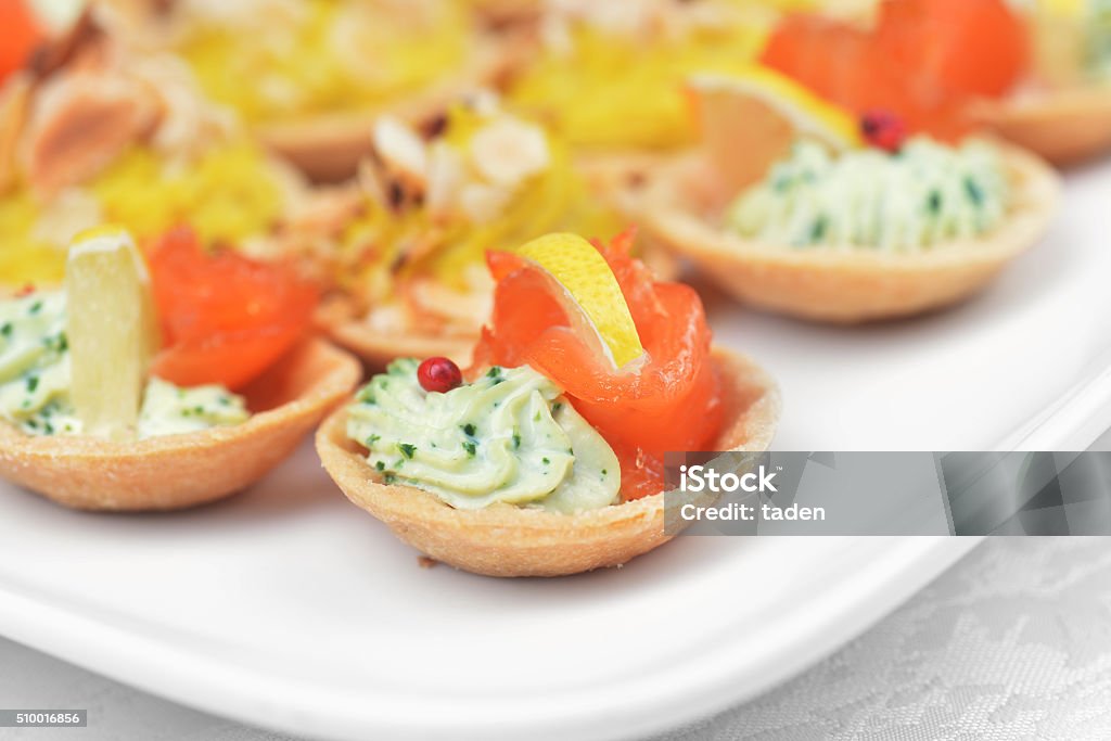 tartlets with  salmon tartlets with cheese sauce and salted salmon Appetizer Stock Photo