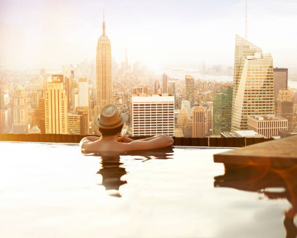 Yong man relaxing on hotel rooftop