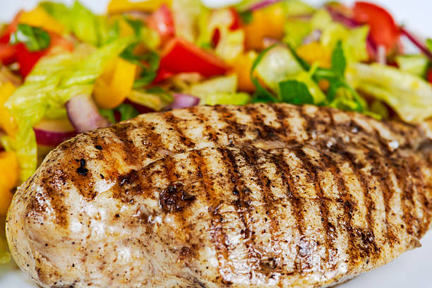istock Close Up Grilled chicken breasts and vegetables. 510018106