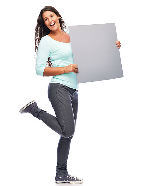 Woman Showing blank billboard stock photo