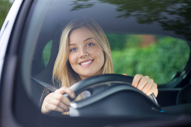 istock young woman driving her car 510040323