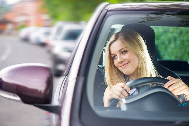 istock young woman driving her car 510040329