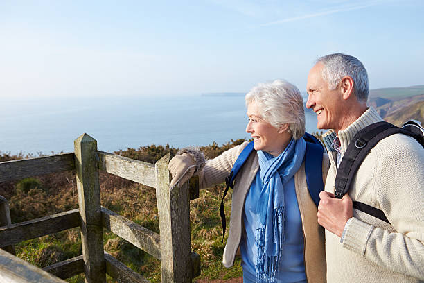 istock Senior Couple Walking Along Coastal Path 510040527