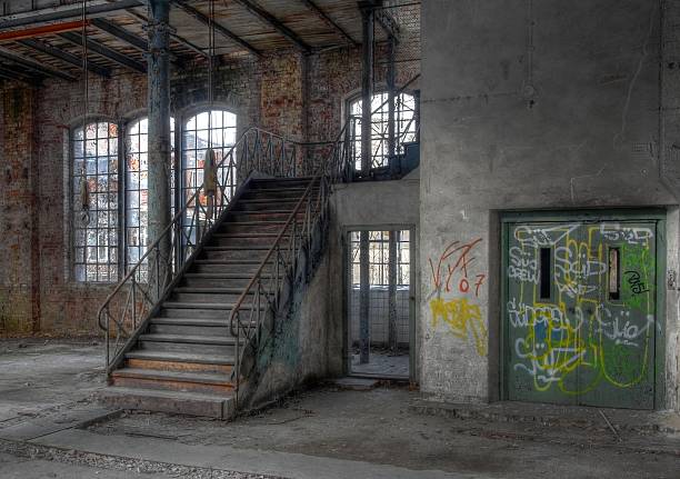 istock Old staircase in an abandoned hall 510040625